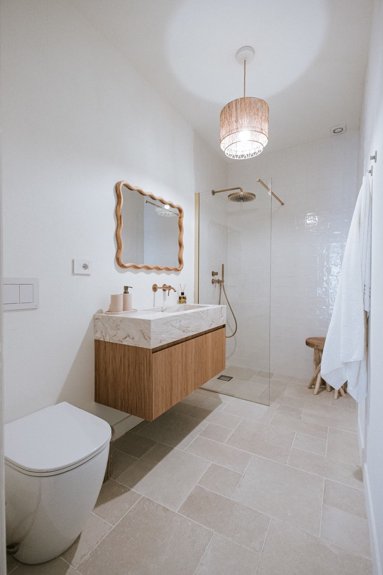 Marble vanity and walk-in shower in the Lula Mare bathroom