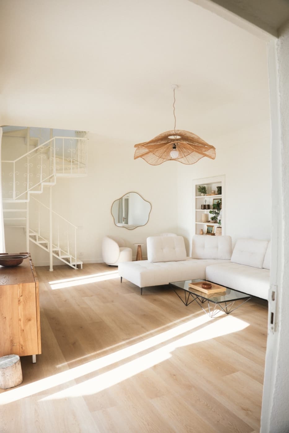 Lula Mare living room with white sofa and staircase